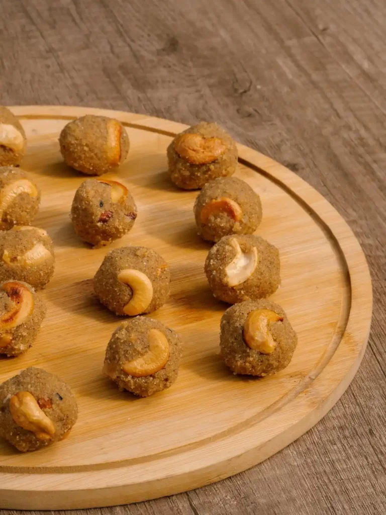 Cashew nut Laddu served on a wooden plate