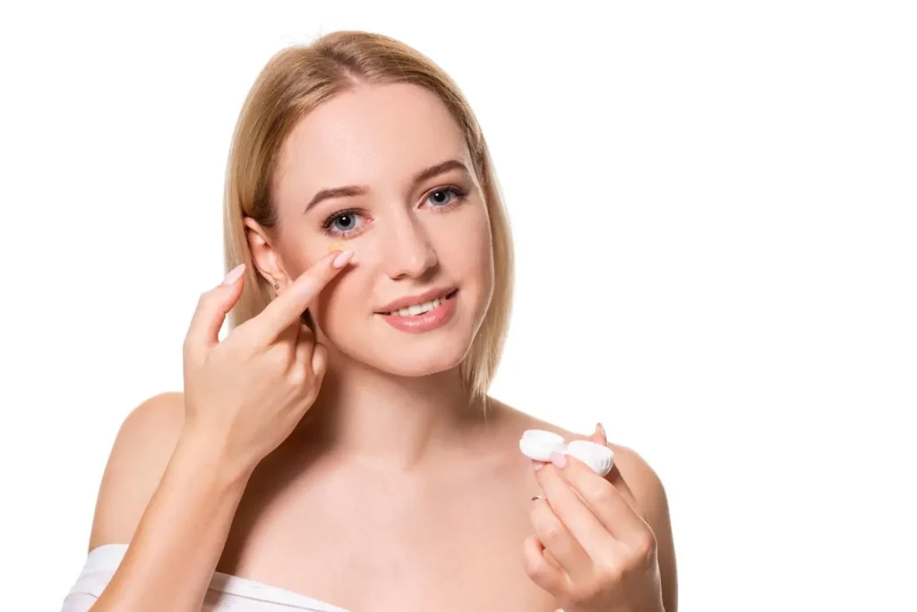 Woman applying eye cream made of Zantye’s Almonds and Cashews.